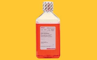 Cell culture buffer bottle on yellow background