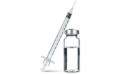 Liquid Formulation Strategies: a clear syringe with black measurement markings and a needle, positioned diagonally above a small glass vial containing a clear liquid.