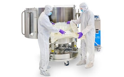 Operators inflating a bag in a Mobius® ADC reactor