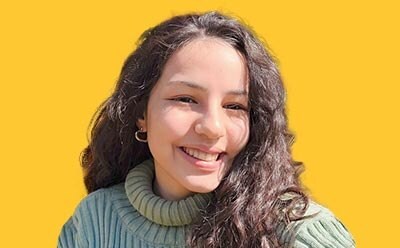 Headshot of Nisan Irem Cetingök with yellow background