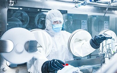 Man in protective gear in a lab