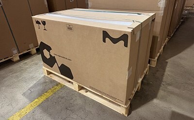 Pallet of shipping boxes with new 100% paper-based edge protectors.