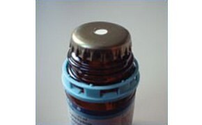 Crown-cap with a PTFE faced rubber liner