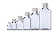 A collection of six clear glass bottles of varying sizes, arranged in ascending order from smallest to largest, against a white background.